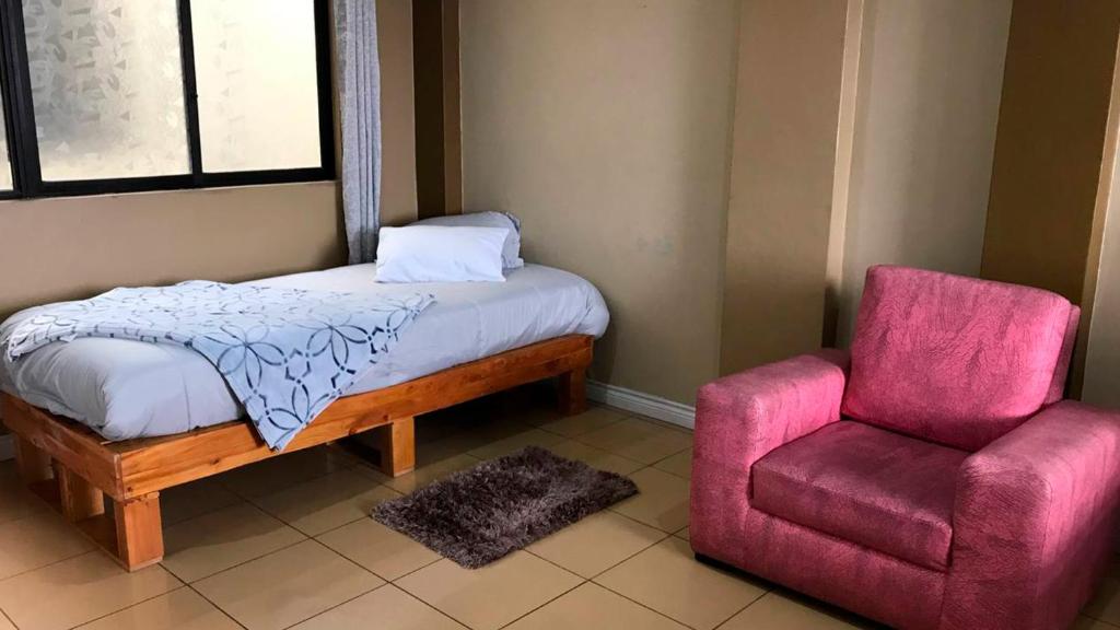 Postel nebo postele na pokoji v ubytování Tin House Quito