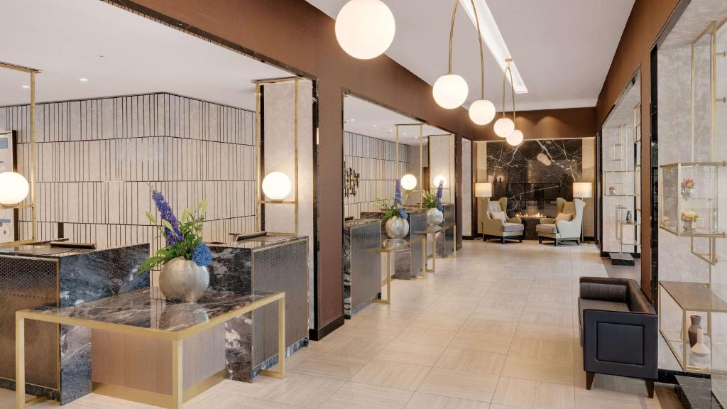 a lobby of a store with a waiting room at Hilton Munich City in Munich