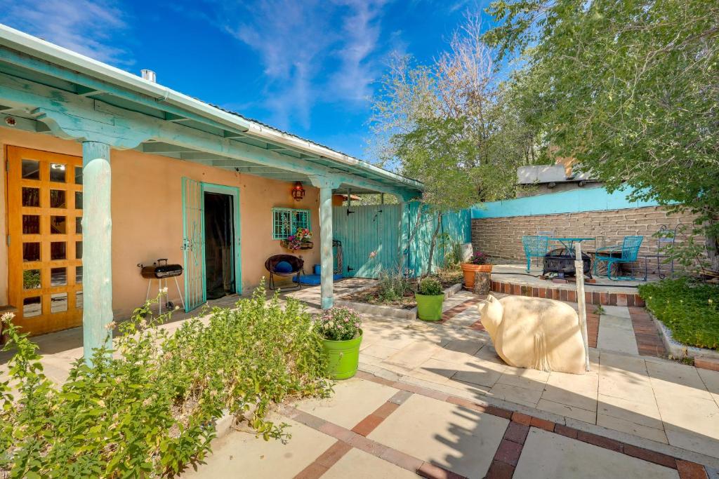 a backyard with a brick building and a house at Beautiful Española Retreat with Patio! in Espanola