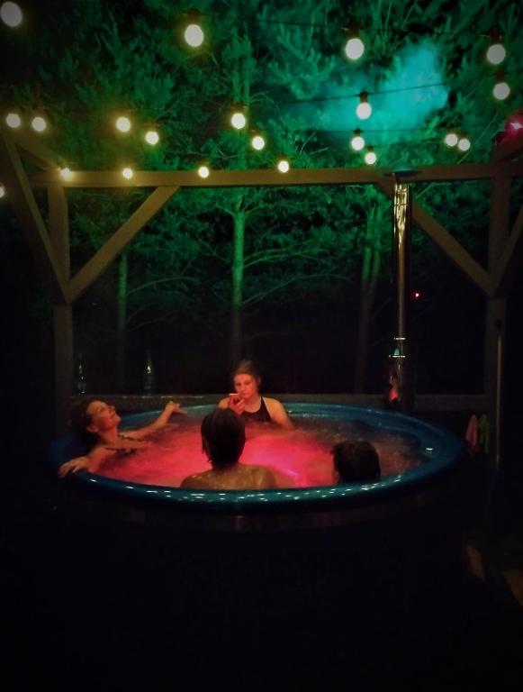 a group of people in a jacuzzi in aysicalysicalysicalysical at Kliukai in Dubingiai