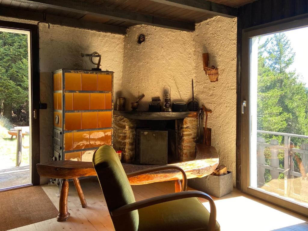 Posezení v ubytování Do-Minus Boutique Home & Private SPA Cà Pedrot Mountain Cottage