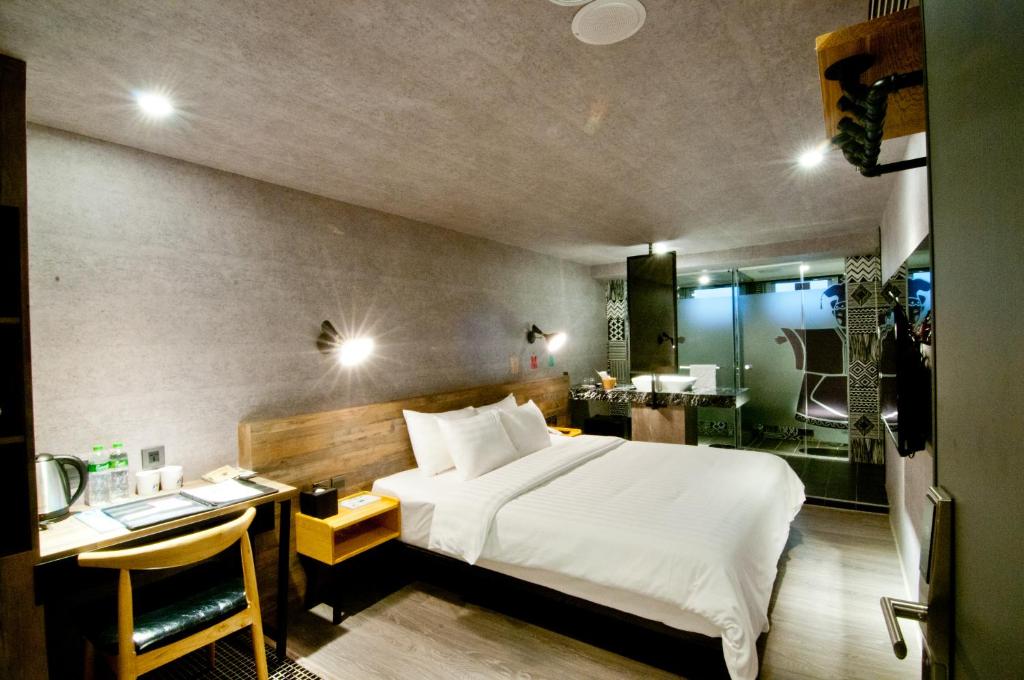 Postel nebo postele na pokoji v ubytování Huwei Hotel