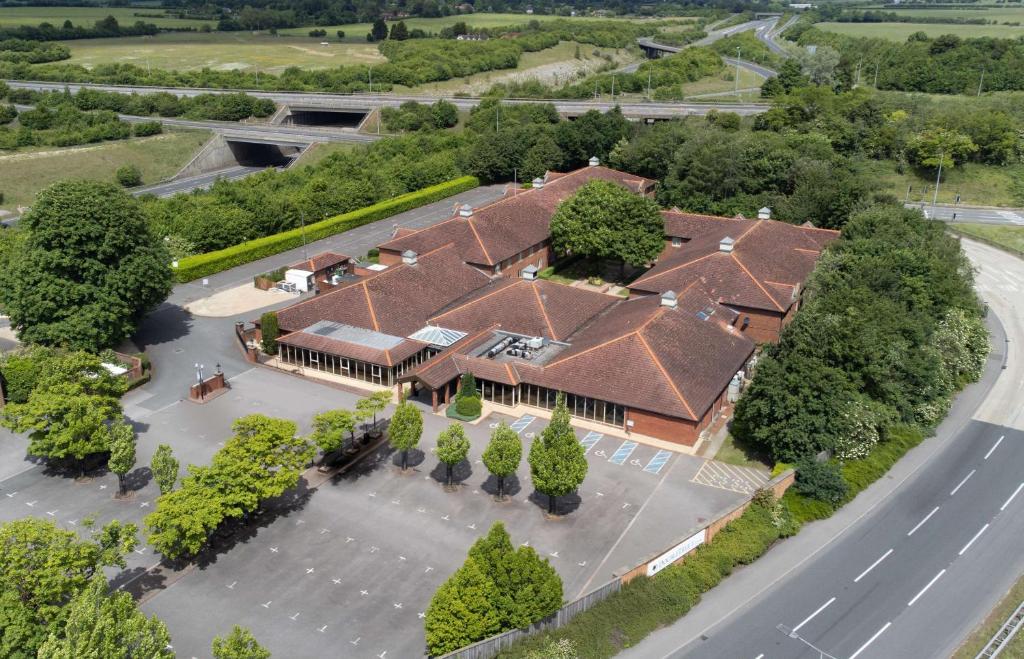 an overhead view of a house with a roof at DoubleTree by Hilton Newbury North in Newbury