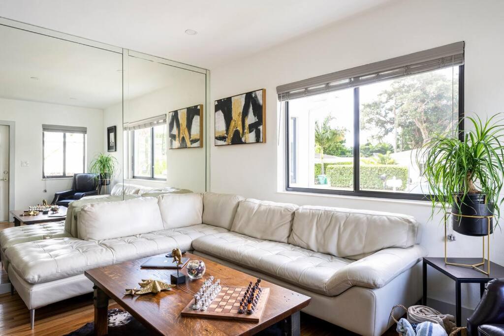 a living room with a white couch and a table at Cozy Place in Miami