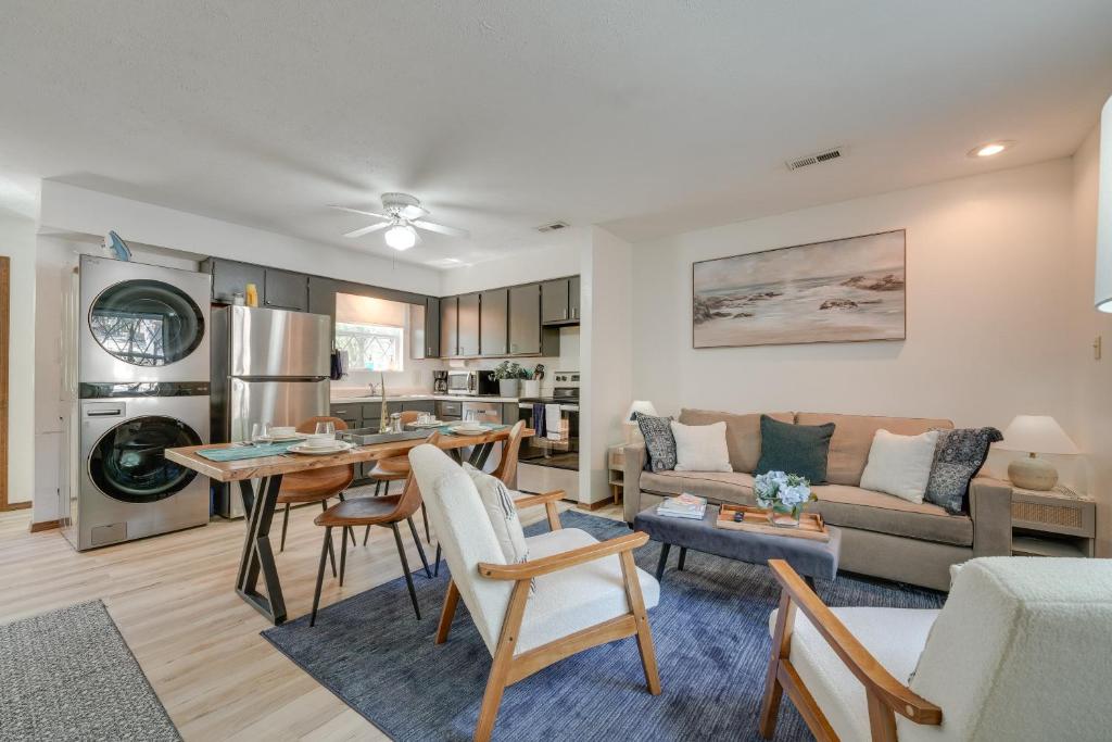a living room with a couch and a table at 3 Mi to Silver Dollar City! Family Getaway w/ Pool in Branson