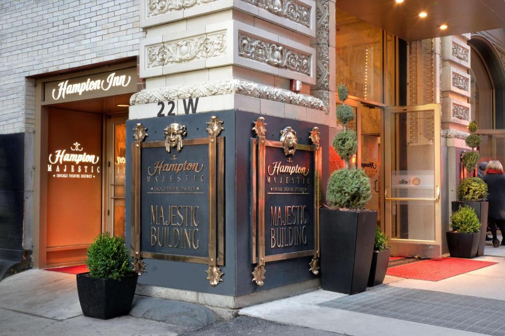 a store front with signs on the side of a building at Hampton Inn Majestic Chicago Theatre District in Chicago