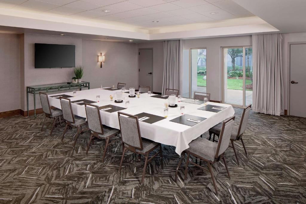 a conference room with a long table and chairs at Embassy Suites by Hilton Boston Marlborough in Marlborough
