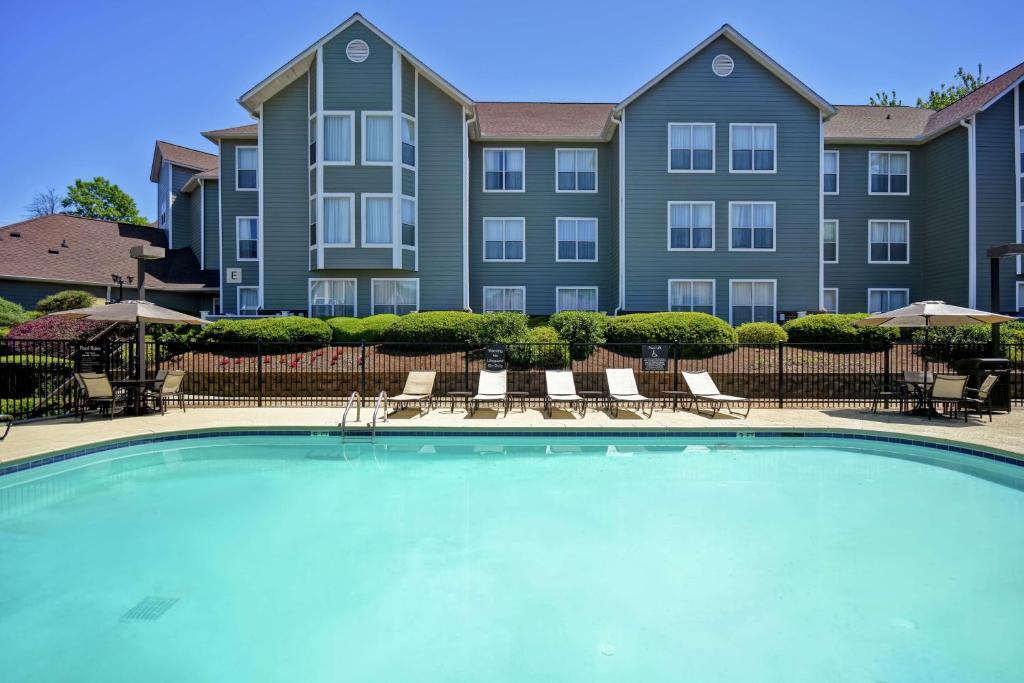 a large swimming pool in front of a building at Homewood Suites by Hilton Atlanta-Galleria/Cumberland in Atlanta