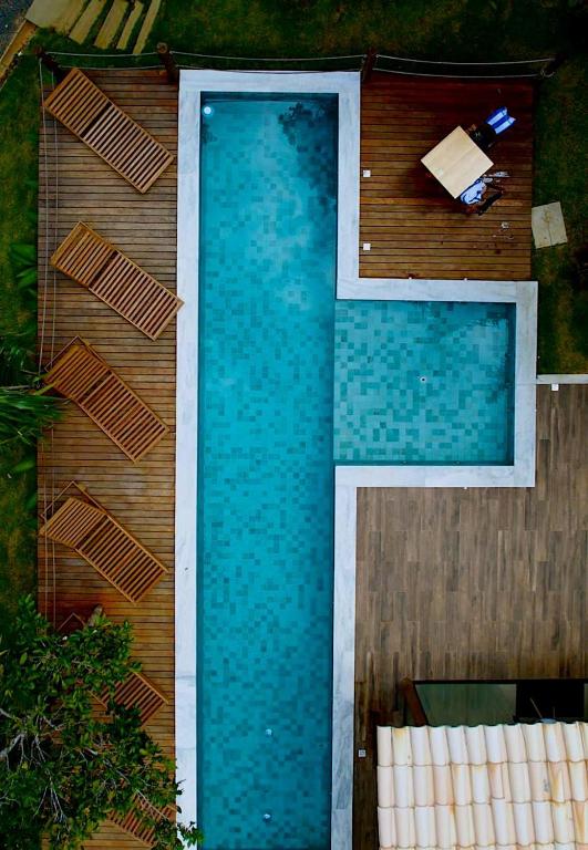 an overhead view of a swimming pool next to a house at Refúgio By Bellatrix Ecolodge in Mata de Sao Joao