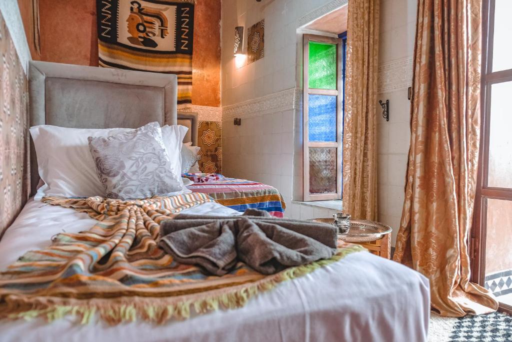 Postel nebo postele na pokoji v ubytování Héritage Lalla Aicha Hotel & Spa