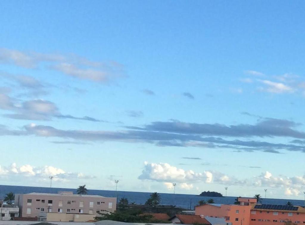 a view of a city with a cloudy sky at Apartamento Peruíbe com vista para o mar in Peruíbe