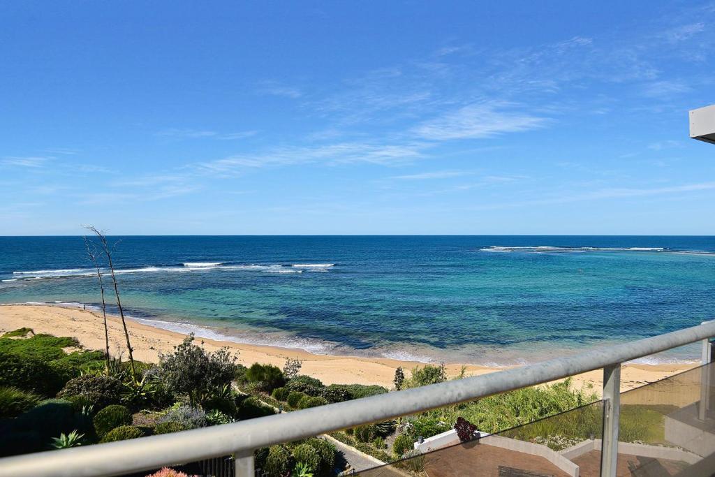 a view of the ocean from a balcony at Beachfront on Werrina in Blue Bay 