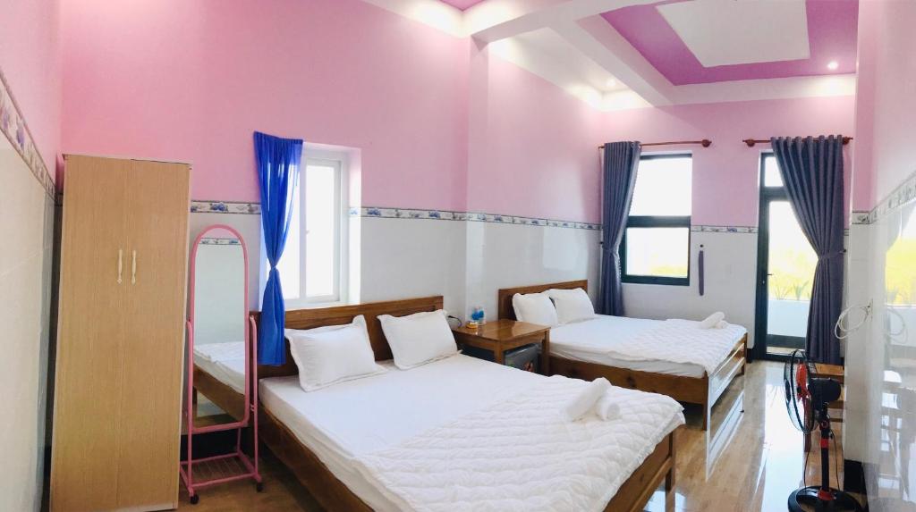 Postel nebo postele na pokoji v ubytování Hồng Phú Motel - Đảo Phú Quý