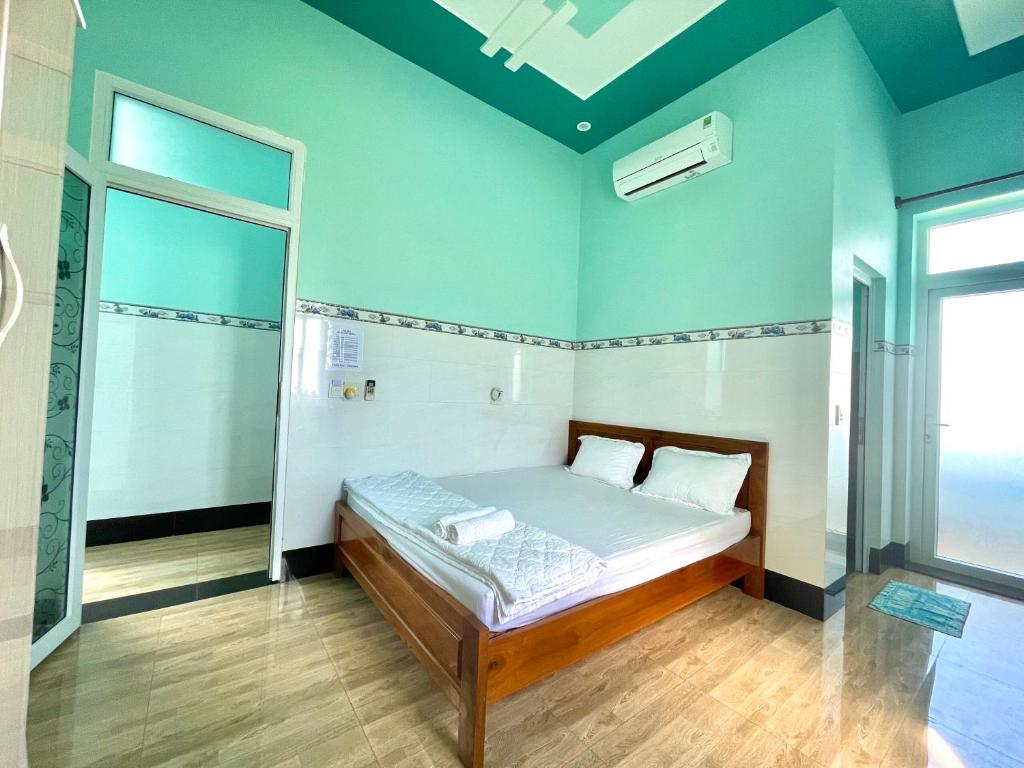 Postel nebo postele na pokoji v ubytování Hồng Phú Motel - Đảo Phú Quý