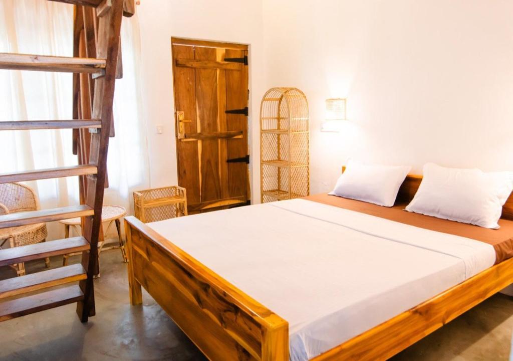 Postel nebo postele na pokoji v ubytování PomPon