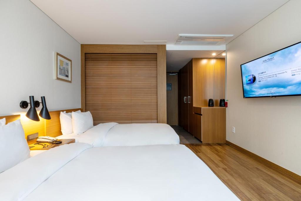 Postel nebo postele na pokoji v ubytování Mate Hotel Paju