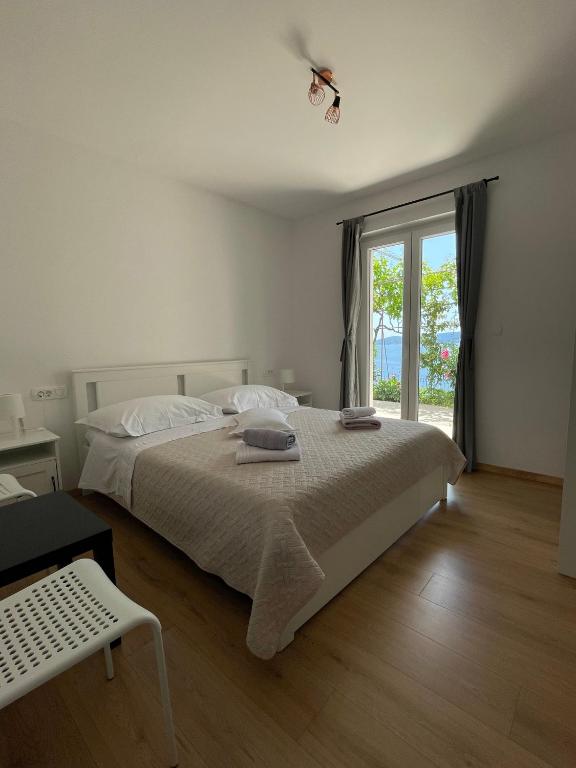 Postel nebo postele na pokoji v ubytování Apartments Tom