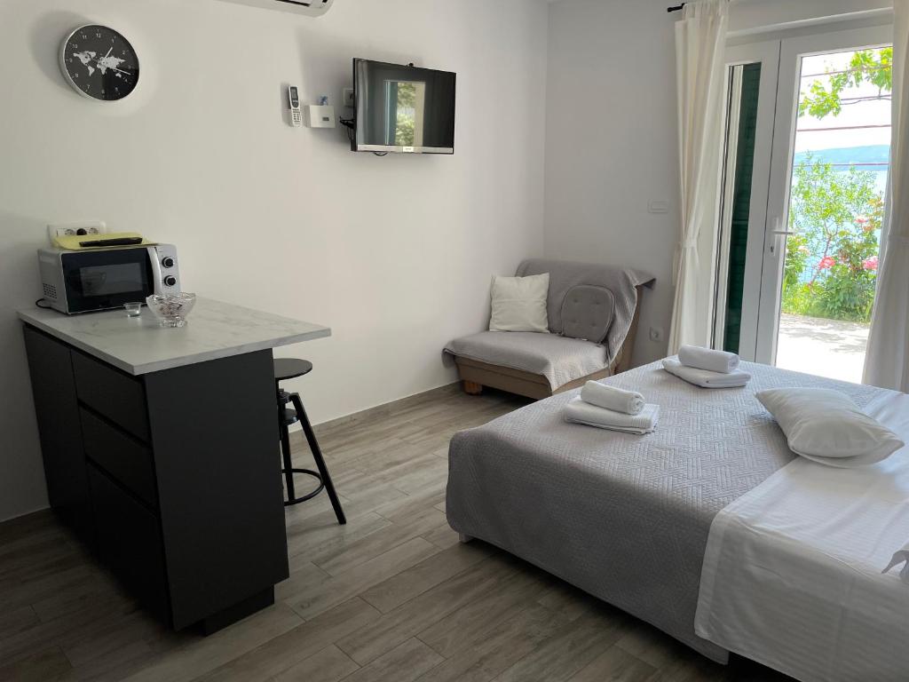 Postel nebo postele na pokoji v ubytování Apartments Tom