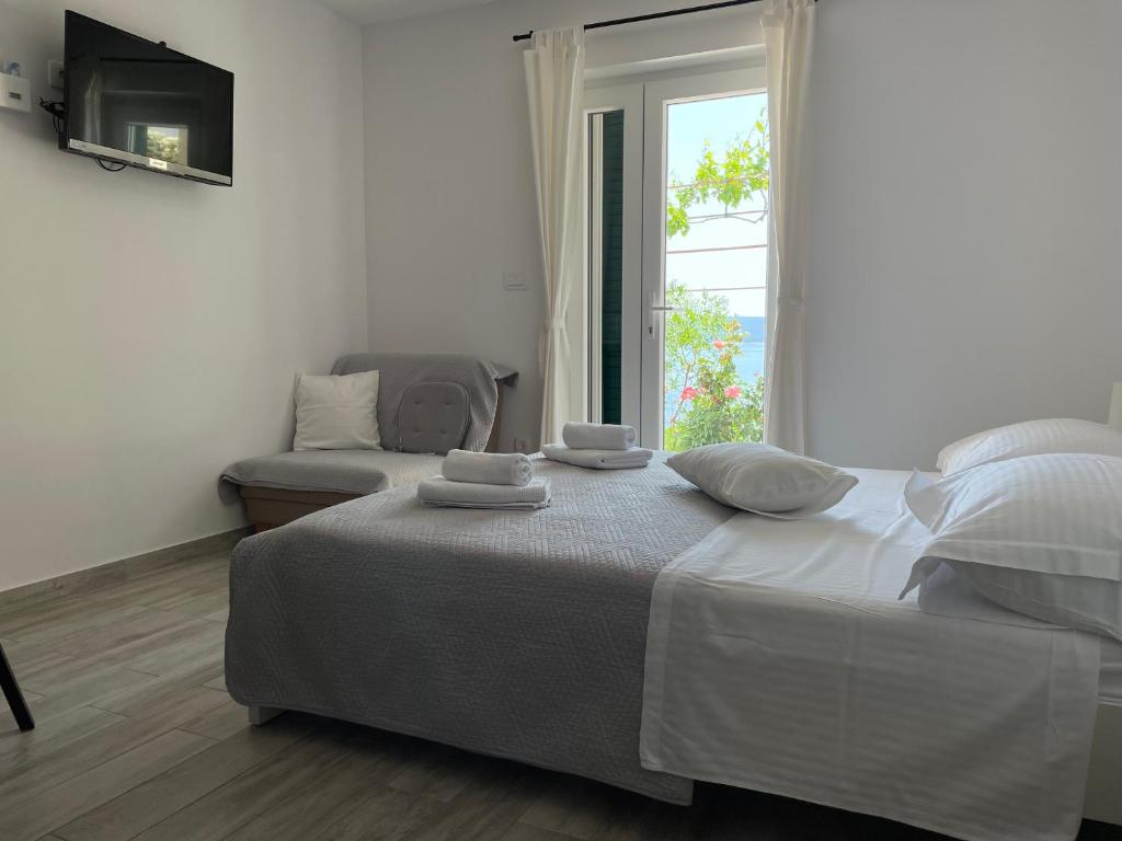 Postel nebo postele na pokoji v ubytování Apartments Tom