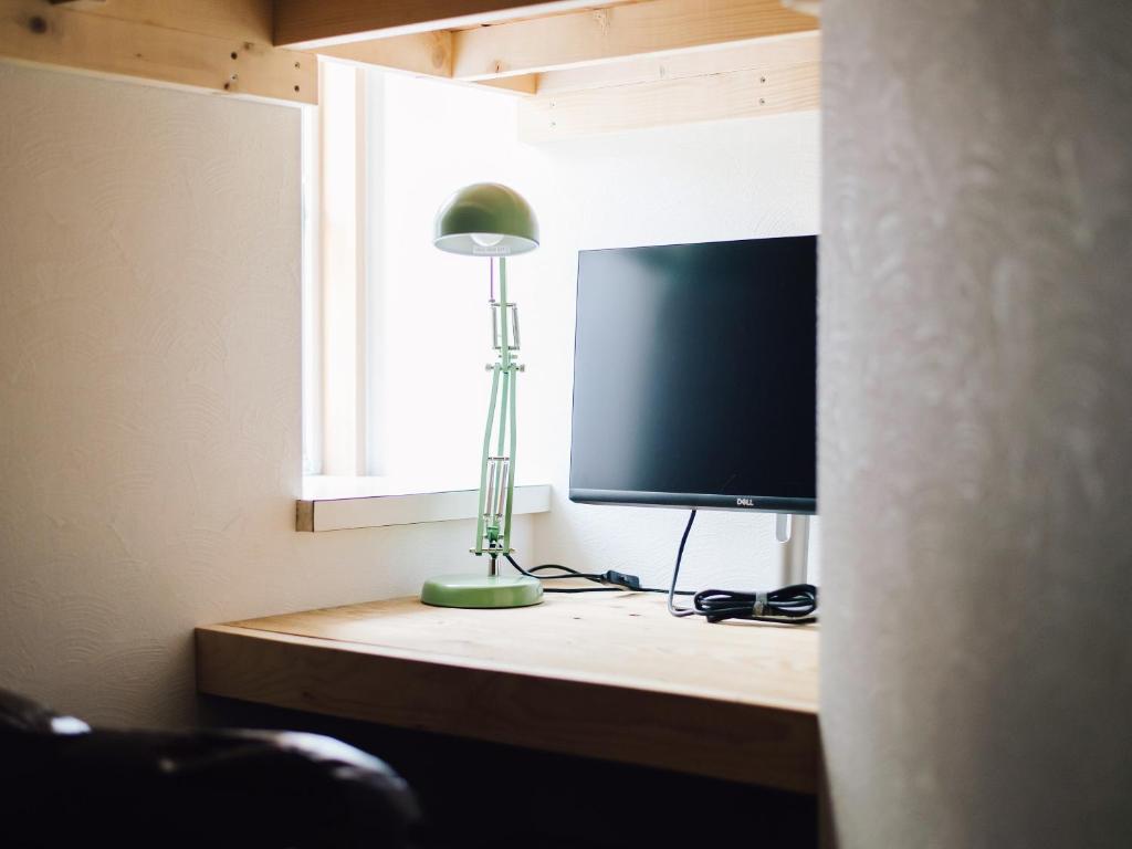 TV a/nebo společenská místnost v ubytování guesthouse SHIBAFU