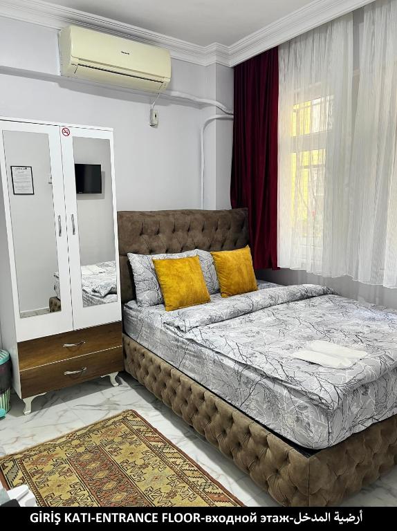 Postel nebo postele na pokoji v ubytování Pembe Hotel