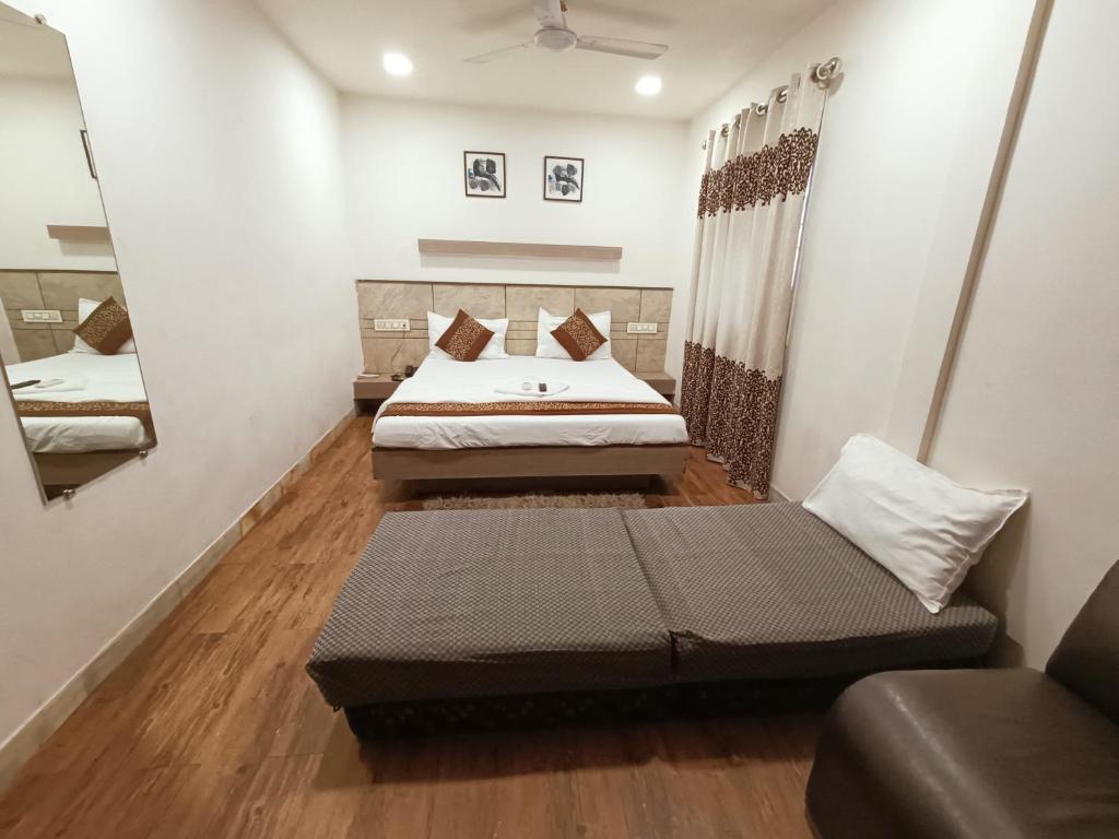 Postel nebo postele na pokoji v ubytování Hotel City Inn