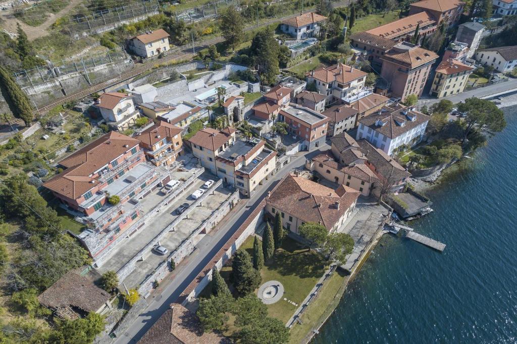 an aerial view of a town next to the water at Fontana Del Lago Apartments in Varenna