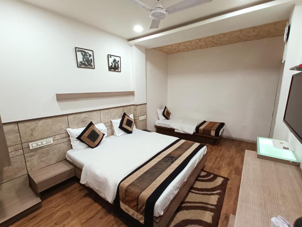 Postel nebo postele na pokoji v ubytování Hotel City Inn