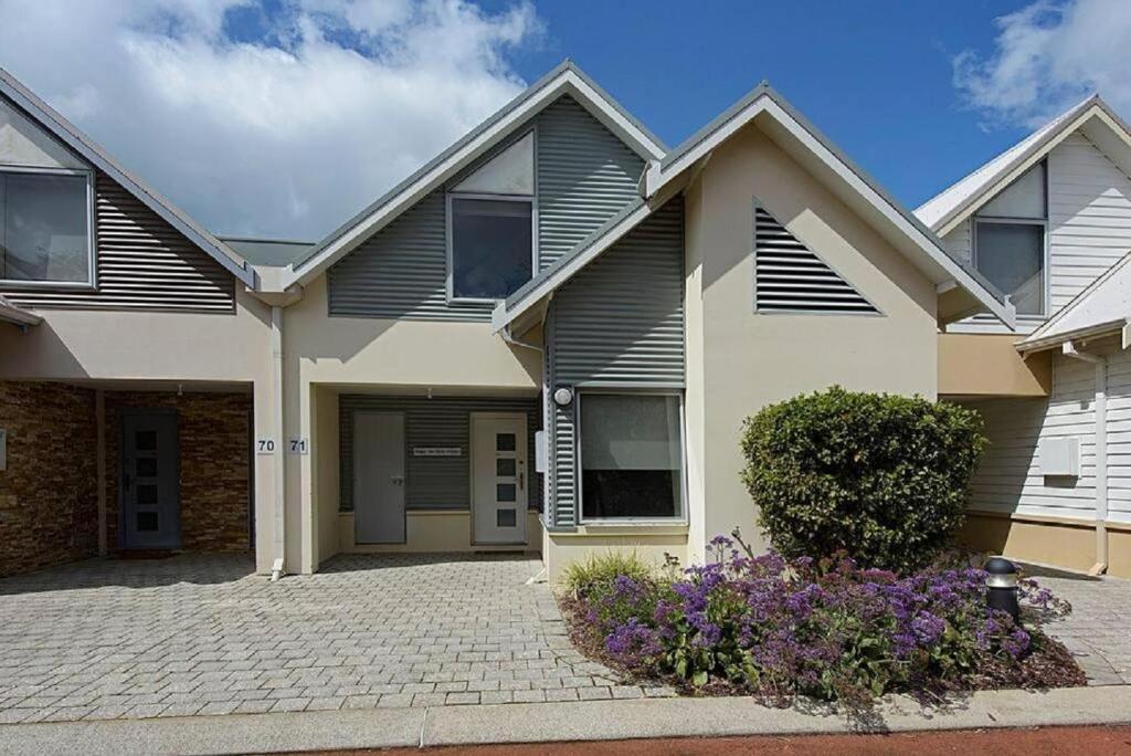 a large house with a driveway at Coastal Elegance - Cape View Resort in Busselton