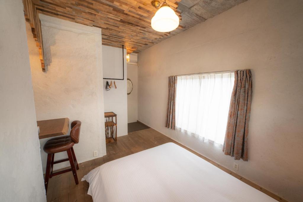 Postel nebo postele na pokoji v ubytování Ichi The Hostel