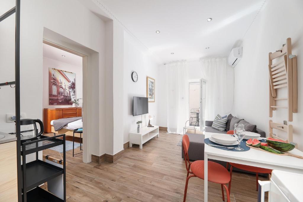 a living room with a kitchen and a dining room at Apartment FERIA 2 in Opatija
