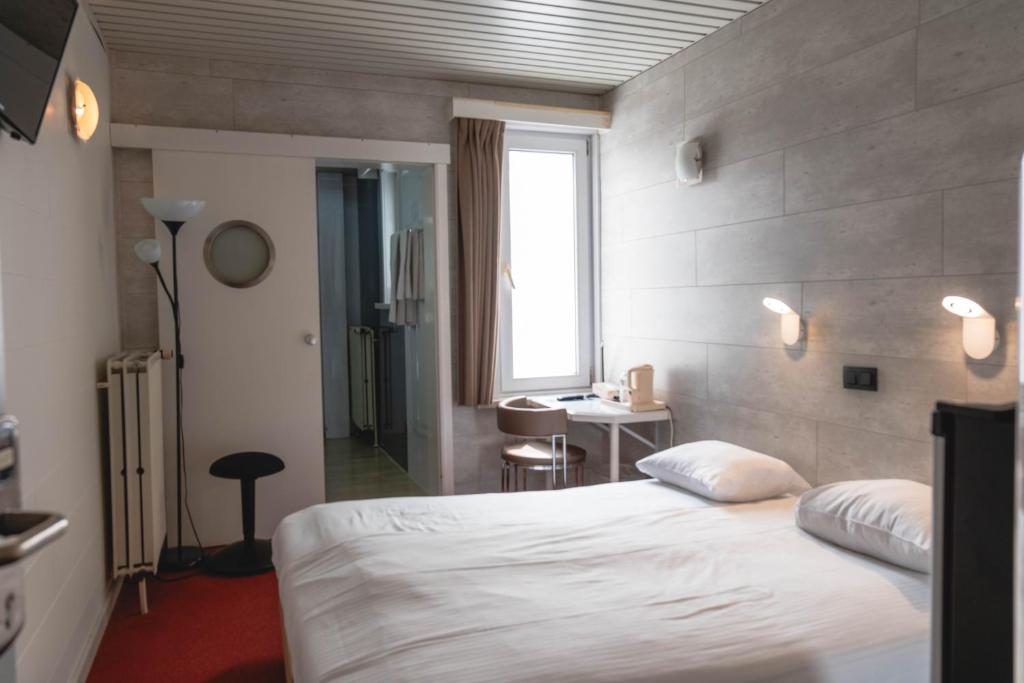 Postel nebo postele na pokoji v ubytování Hotel Richmond
