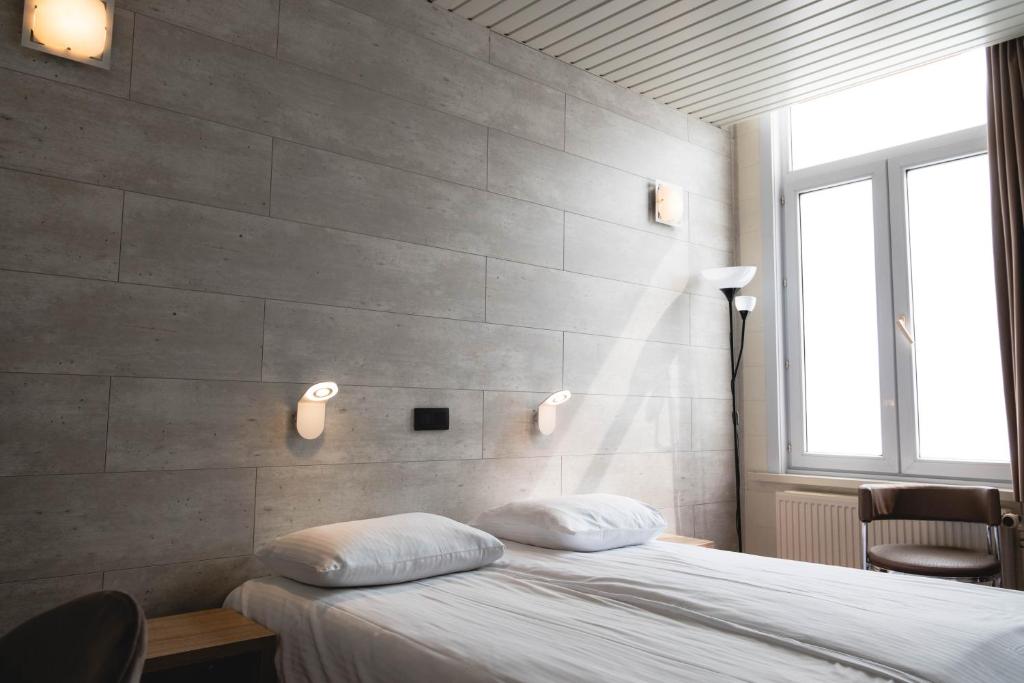 Postel nebo postele na pokoji v ubytování Hotel Richmond