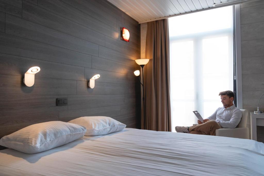 Postel nebo postele na pokoji v ubytování Hotel Richmond