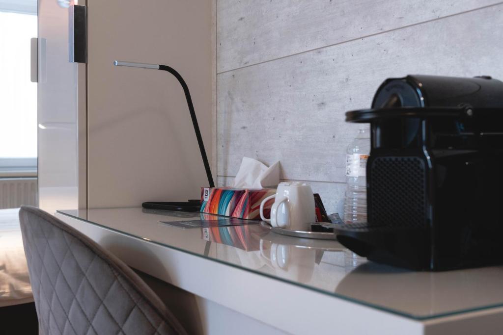 Příslušenství pro přípravu čaje a kávy v ubytování Hotel Richmond