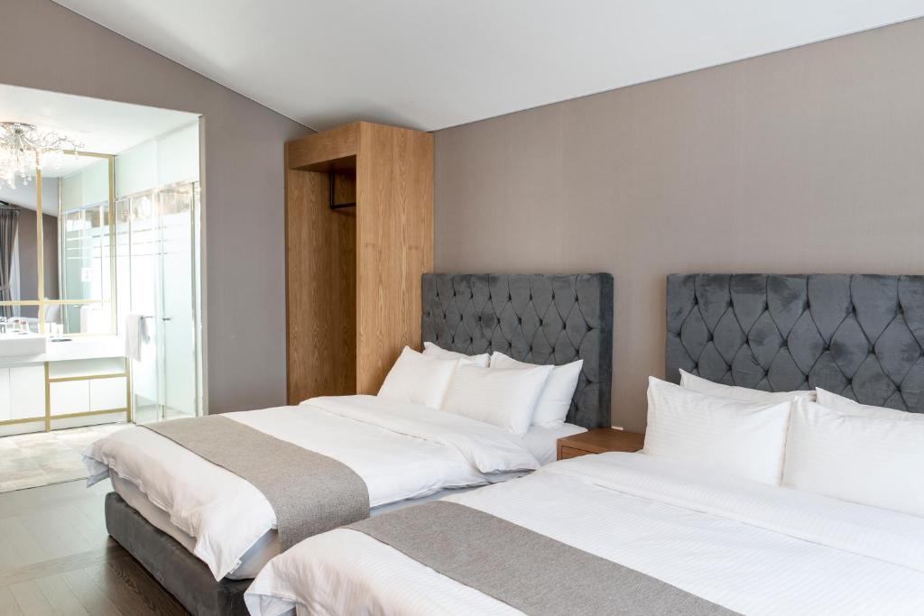 Postel nebo postele na pokoji v ubytování MJ Resort