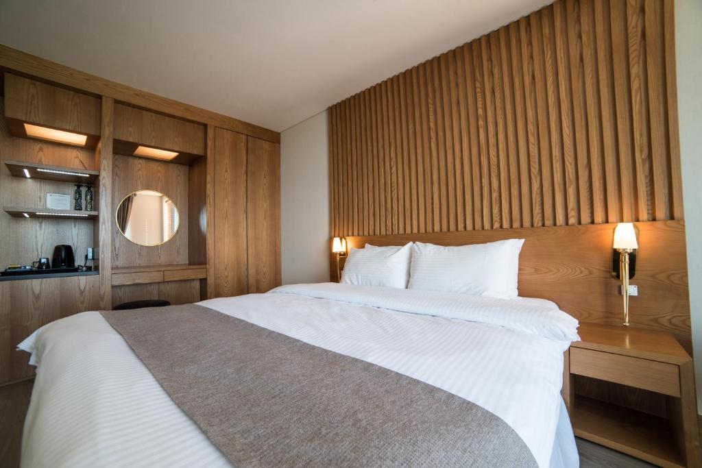 Postel nebo postele na pokoji v ubytování MJ Resort