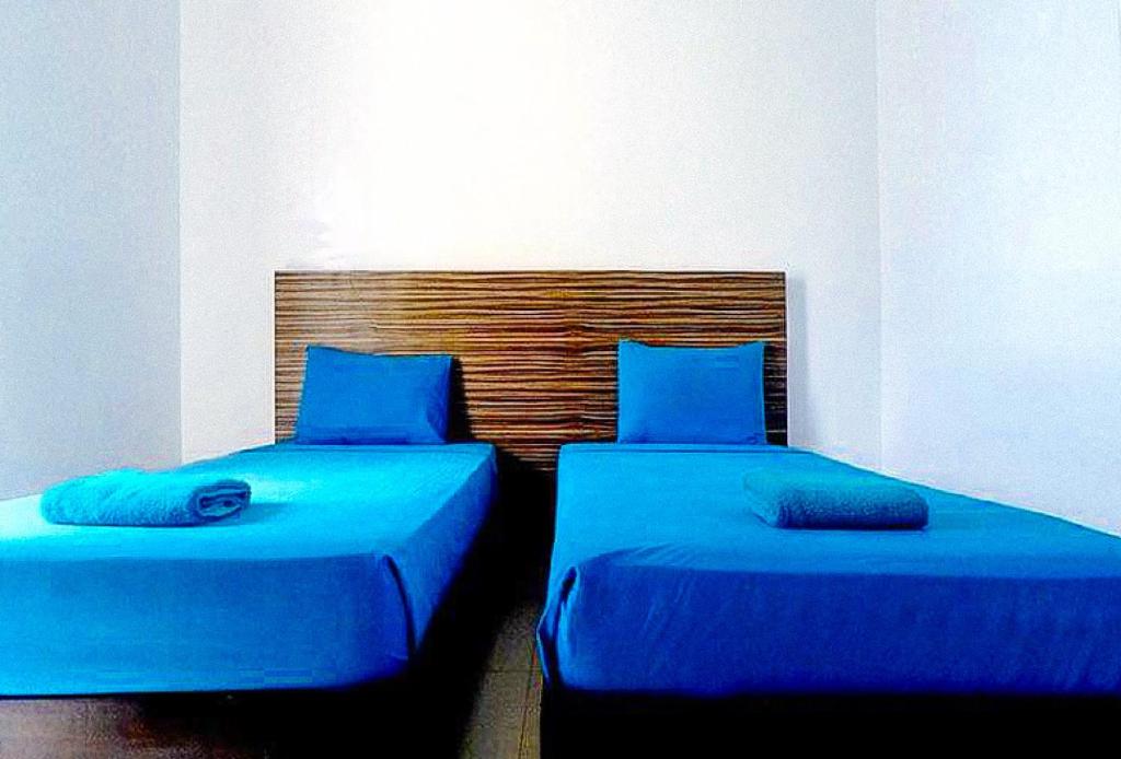 Postel nebo postele na pokoji v ubytování RedDoorz at Sir G Hotel D'Mall Boracay