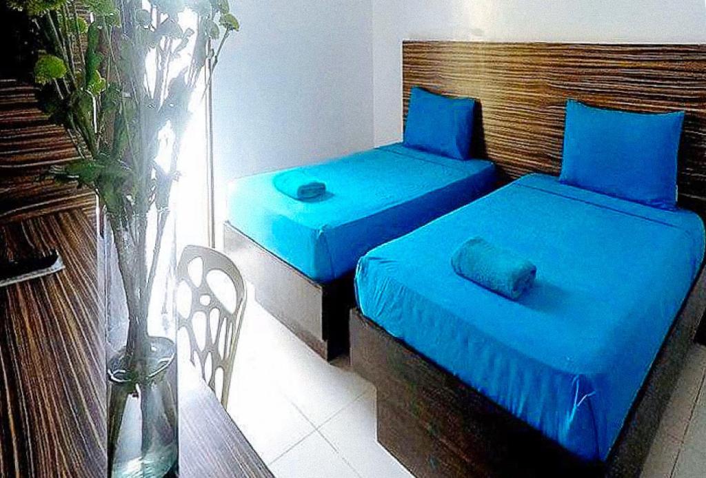 Postel nebo postele na pokoji v ubytování RedDoorz at Sir G Hotel D'Mall Boracay