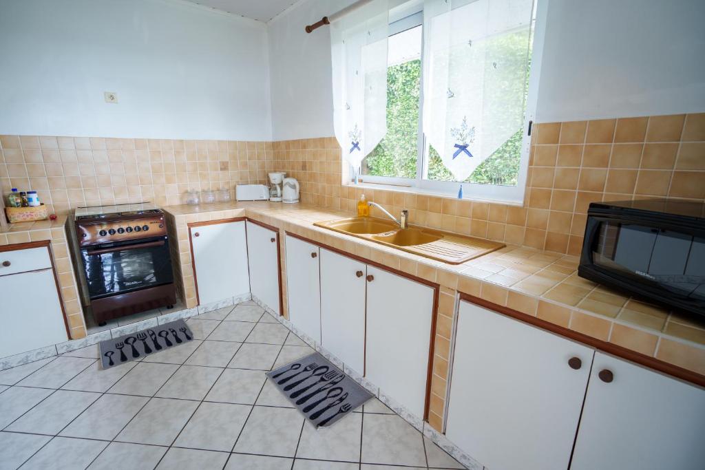 Kuchyň nebo kuchyňský kout v ubytování Noha Lodge