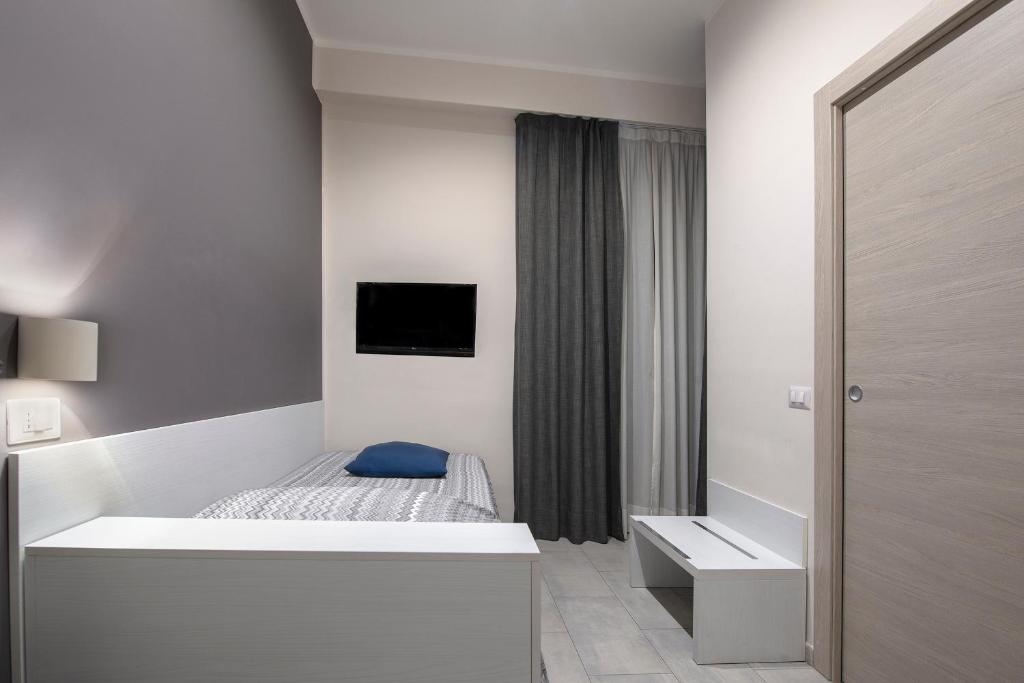Postel nebo postele na pokoji v ubytování Hotel Assarotti