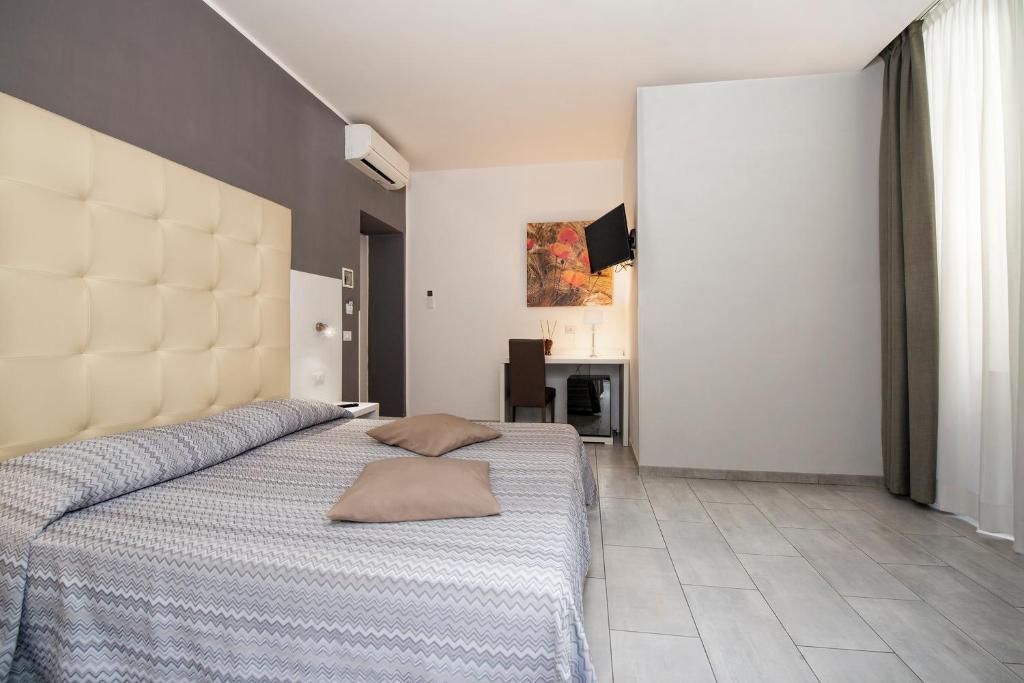 Postel nebo postele na pokoji v ubytování Hotel Assarotti