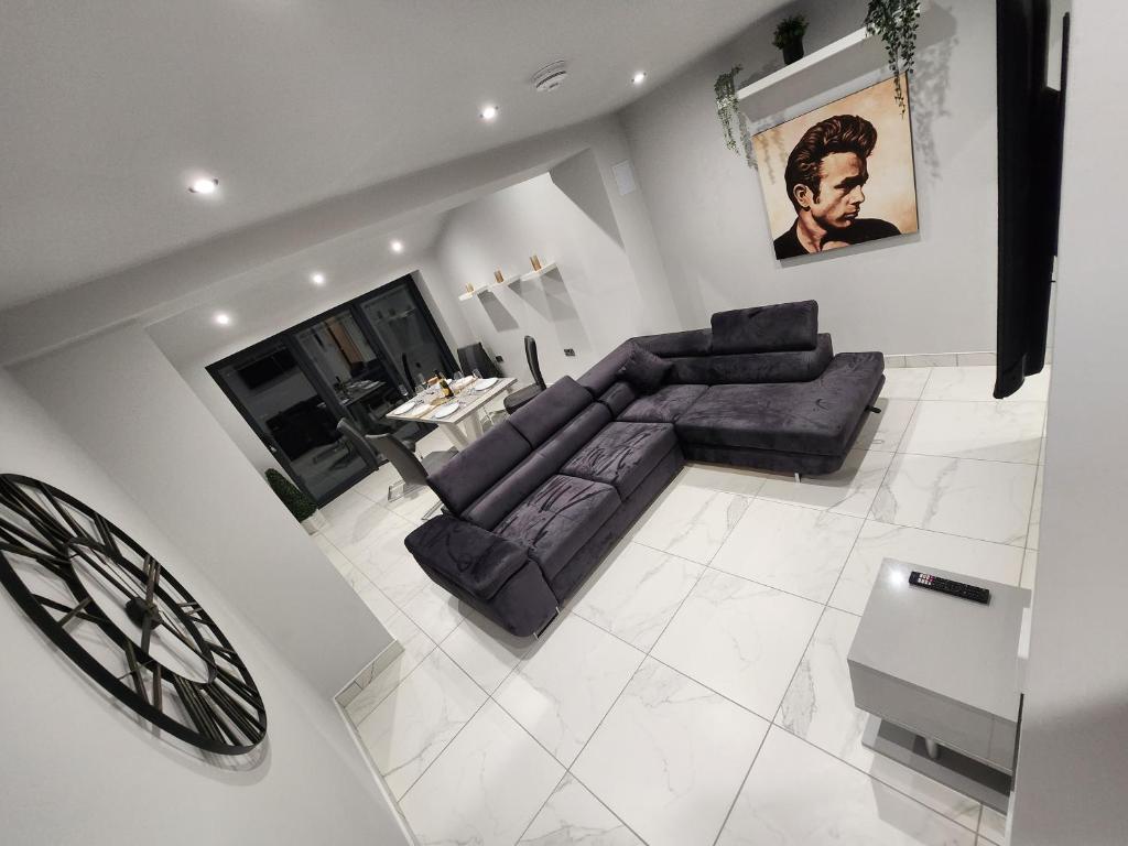 an overhead view of a living room with a couch at Billie Island apartments in Slaithwaite