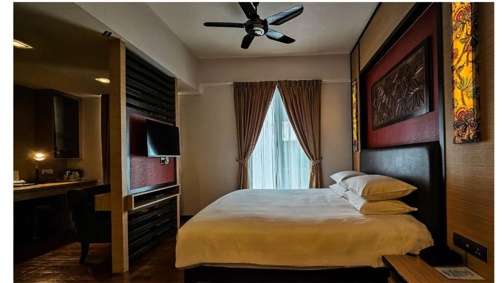 Postel nebo postele na pokoji v ubytování Hotel Richbaliz Selayang