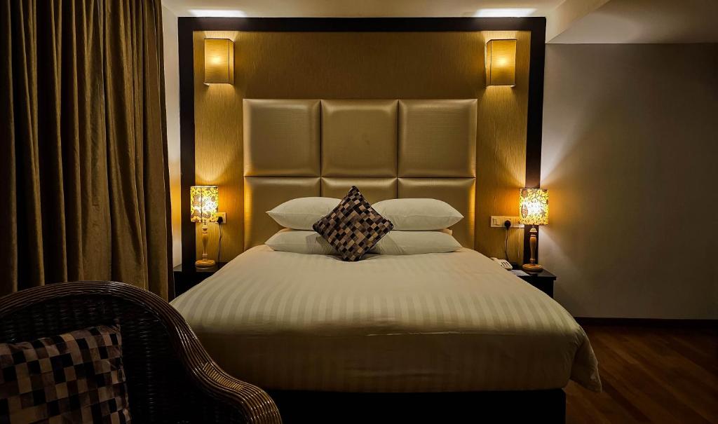 Postel nebo postele na pokoji v ubytování Hotel Richbaliz Selayang