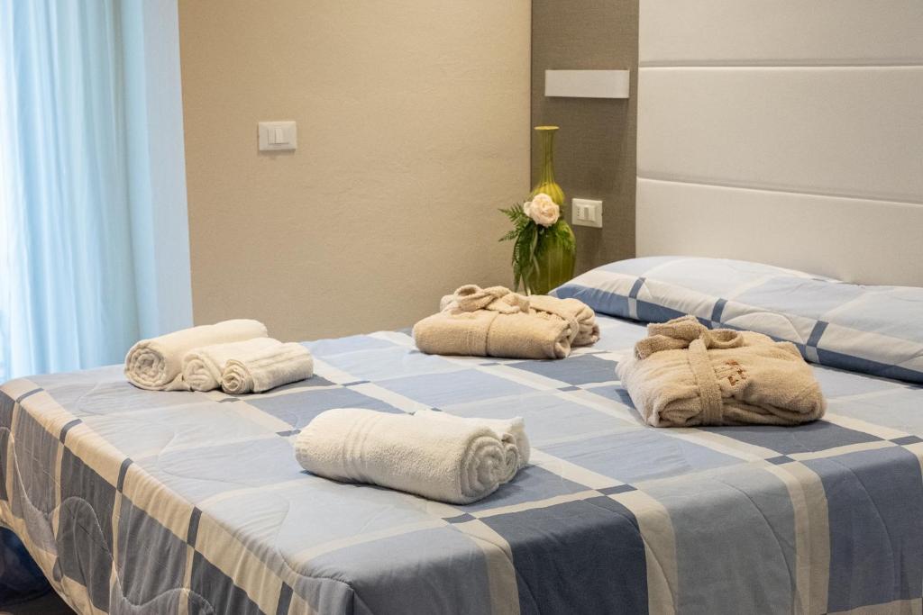 Postel nebo postele na pokoji v ubytování Hotel Pironi