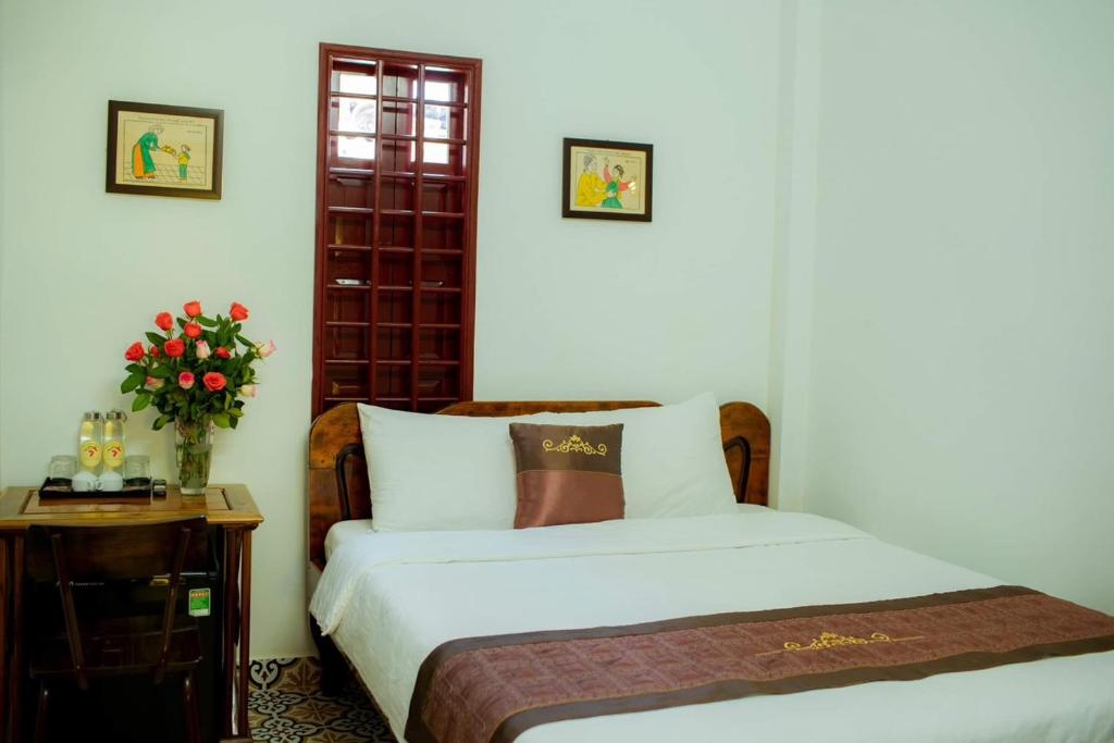 Postel nebo postele na pokoji v ubytování SEVEN HOMESTAY(HUE)