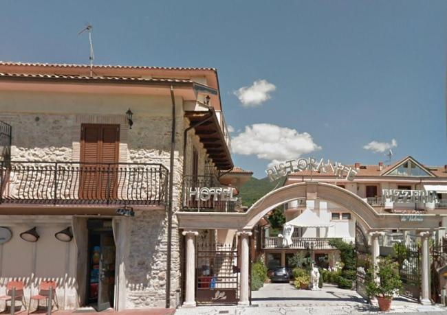 a group of buildings with a building with a balcony at Hotel Ristorante "Da Valerio" in Cittaducale