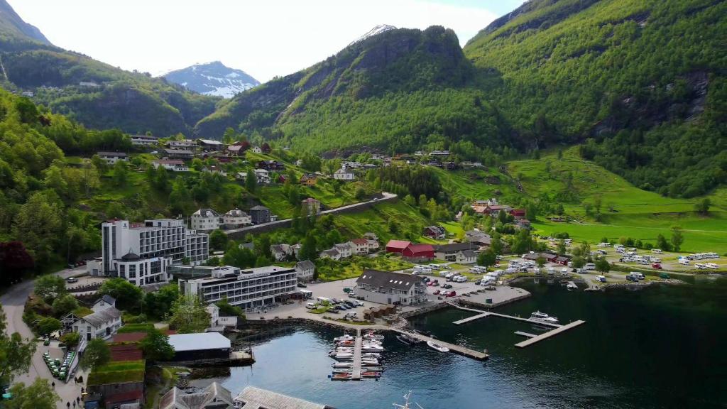 an aerial view of a town in the mountains at Havila Hotel Geiranger in Geiranger