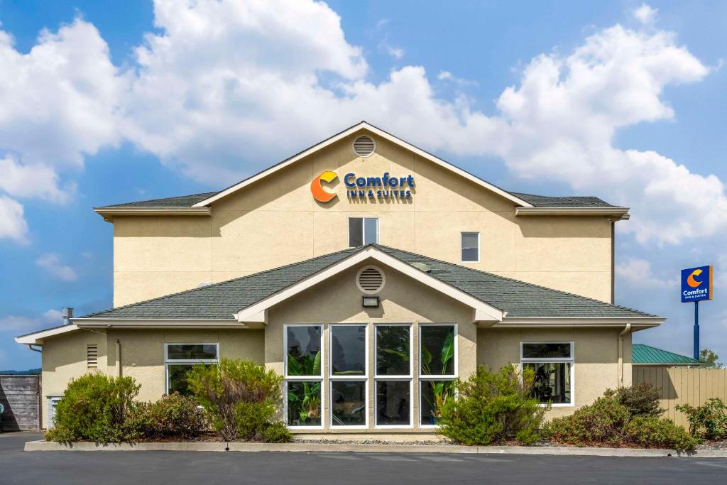 a building with a sign on the top of it at Comfort Inn & Suites Redwood Country in Fortuna